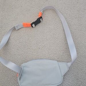 lululemon athletica Light Blue Crossbody Bag with White Strap and Orange Accents